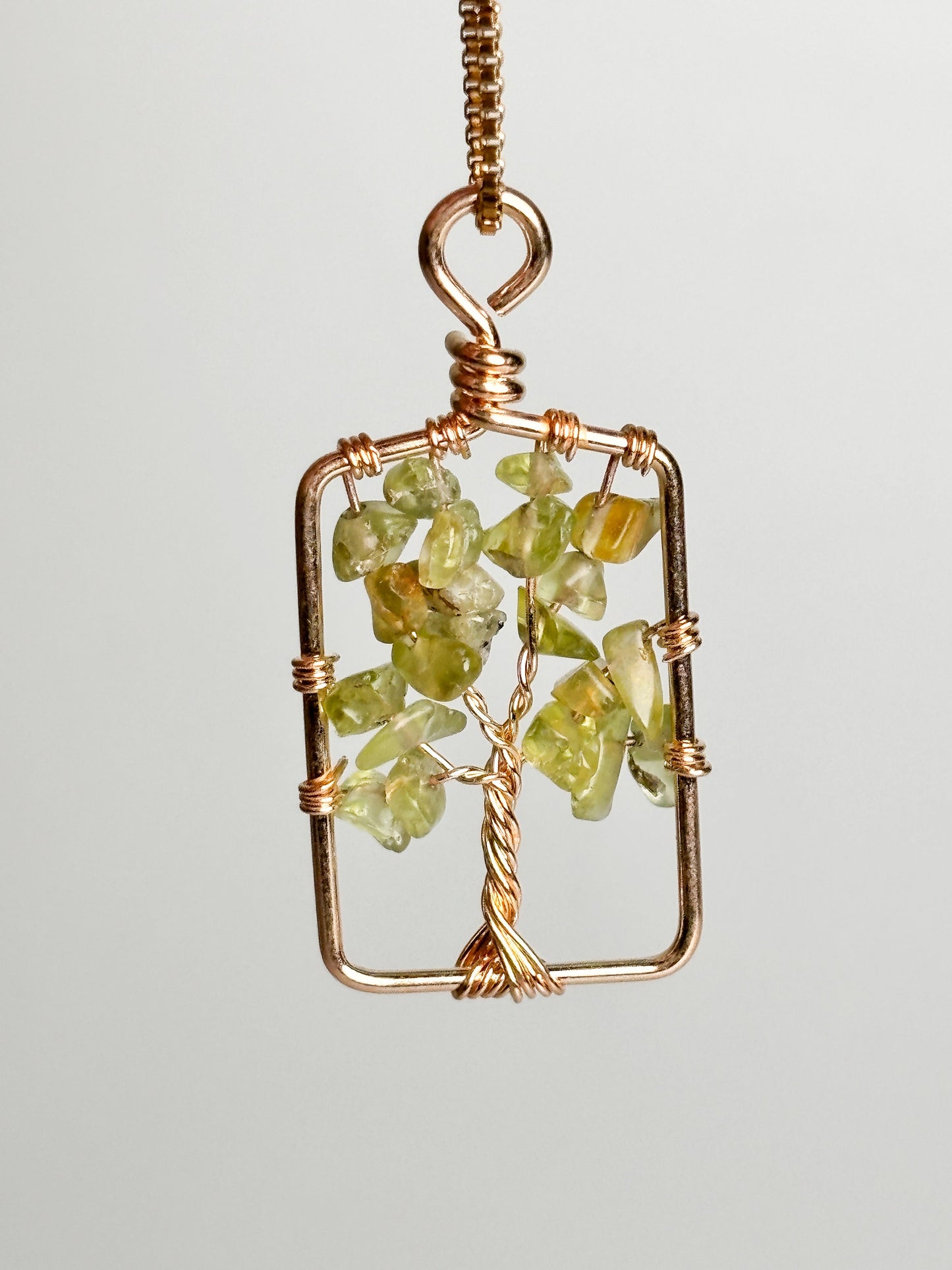 Tree of Life pendant with peridot: symbol of connection and vitality