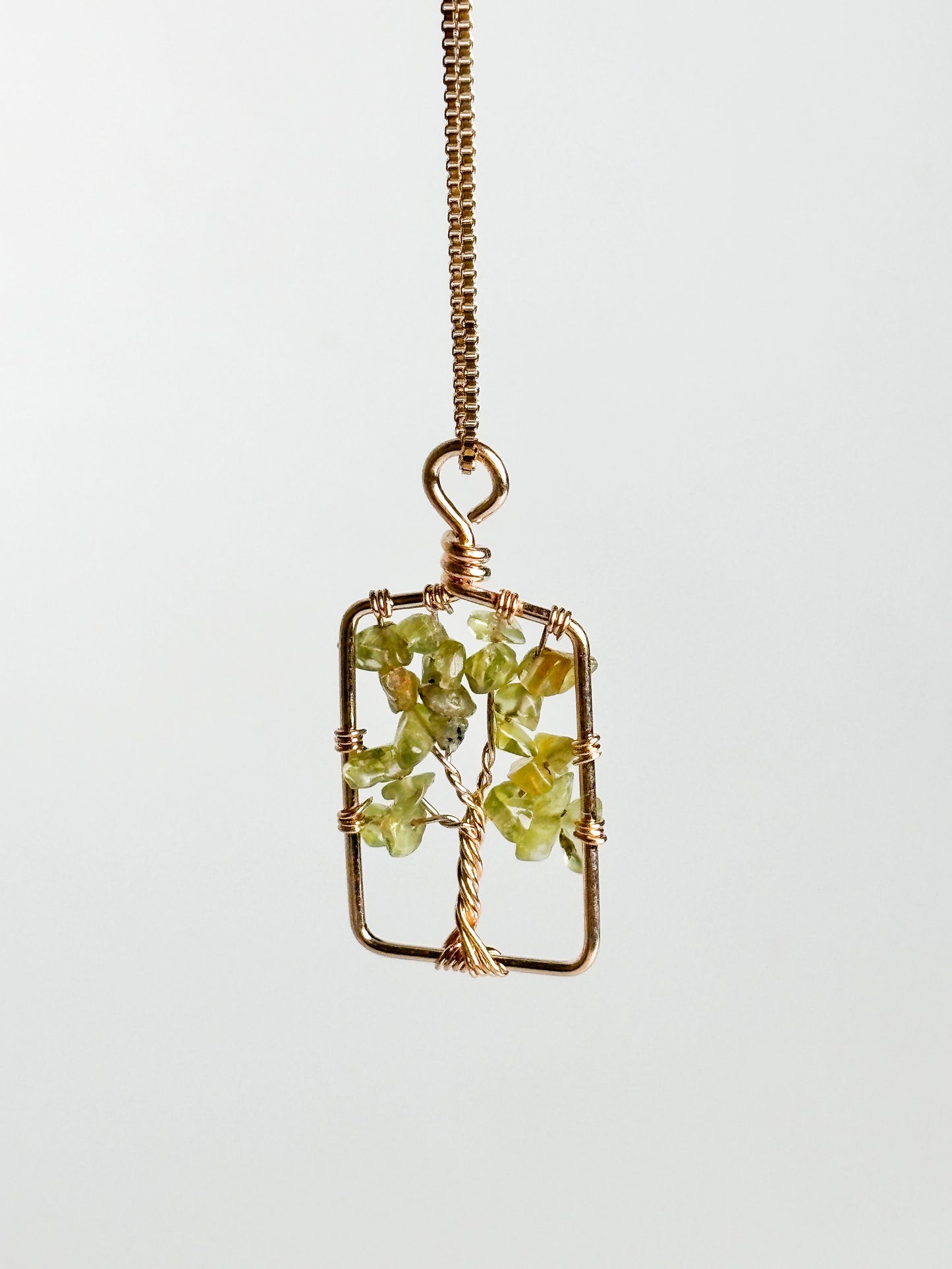 Tree of Life pendant with peridot: symbol of connection and vitality
