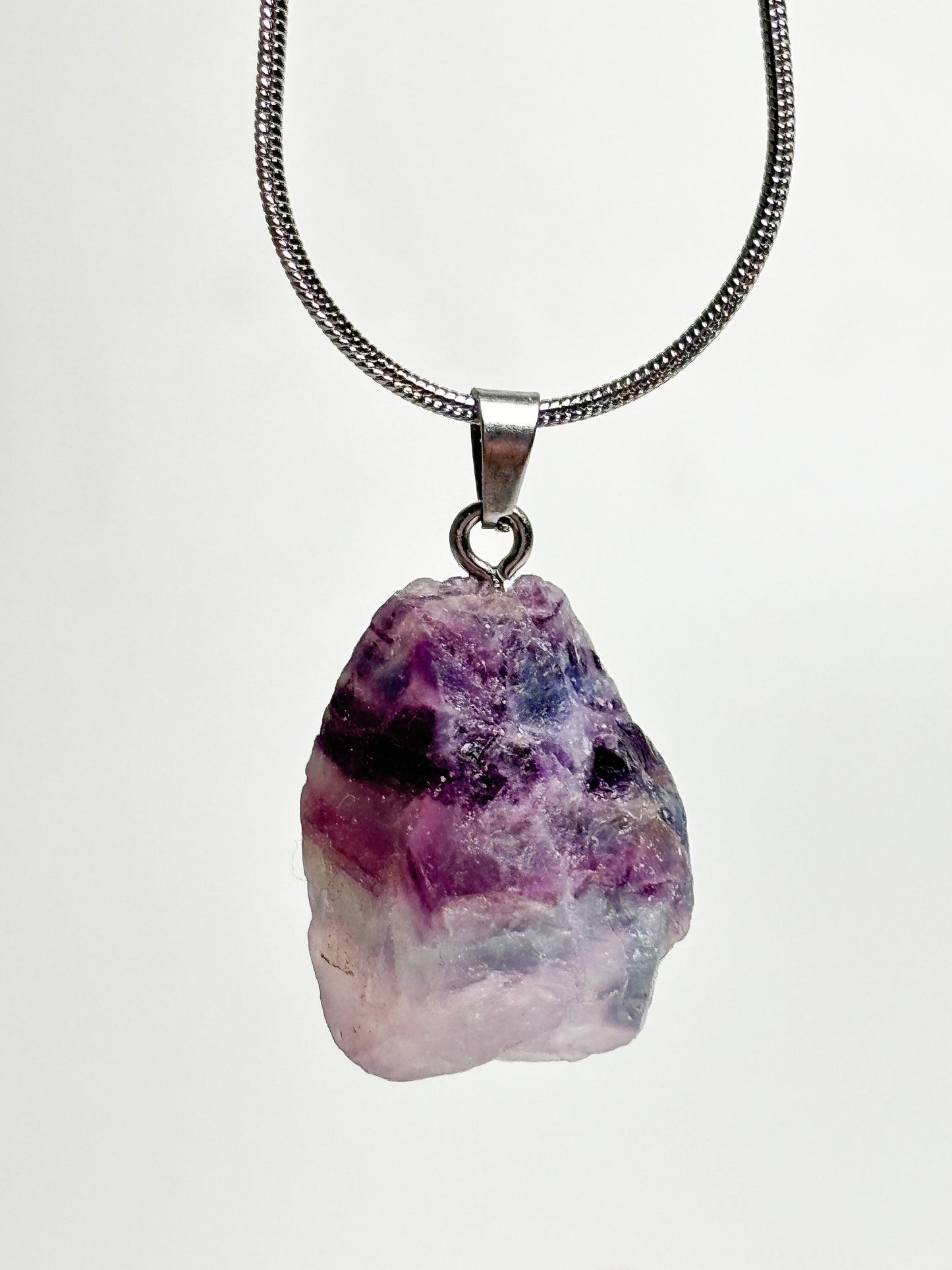 Fluorite raw stone pendant with silver eyelet - size approx. 2.4x1.7cm