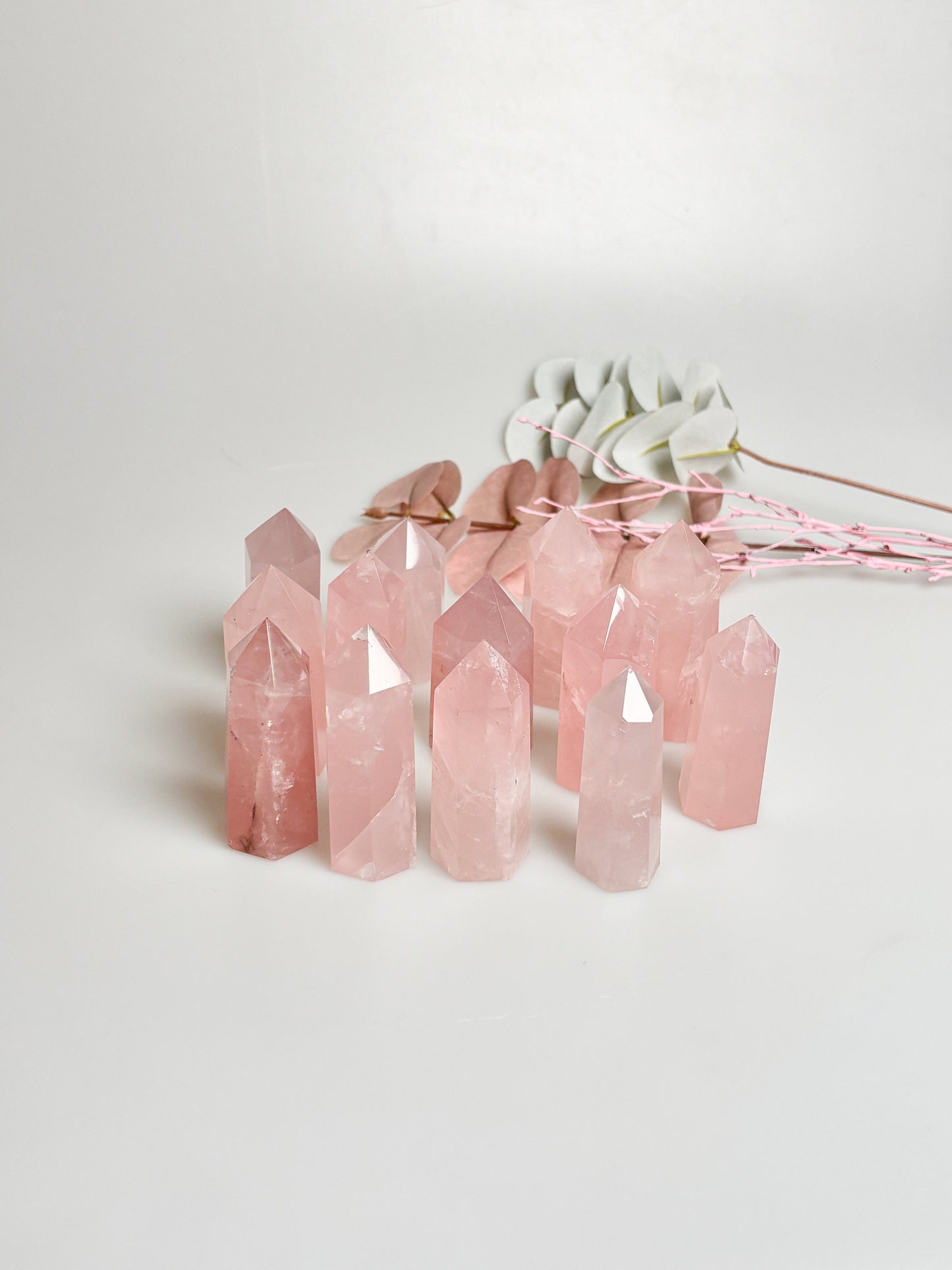 Beautiful rose quartz towers with rainbows - healing crystal for love and harmony, natural stone decoration