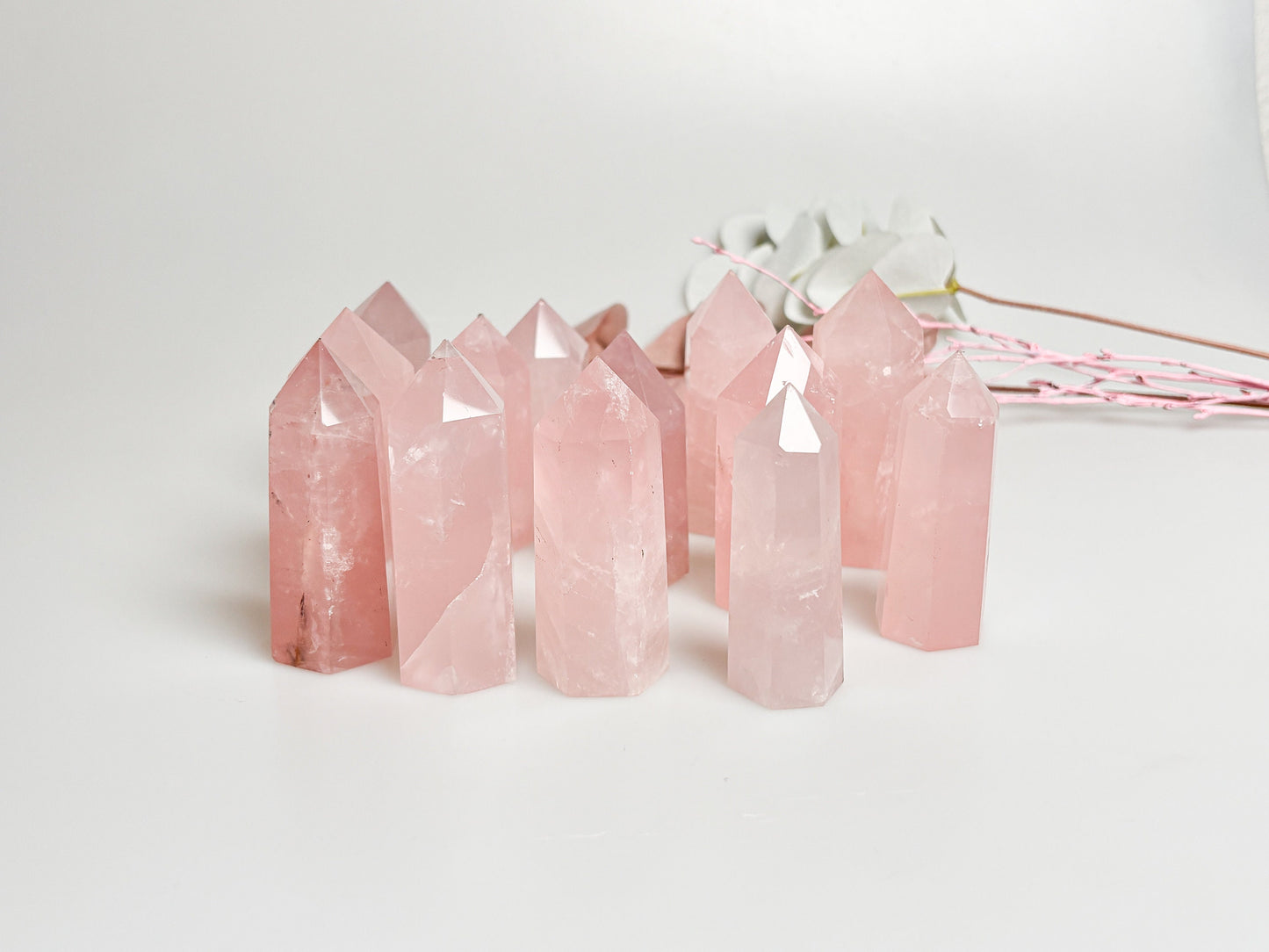 Beautiful rose quartz towers with rainbows - healing crystal for love and harmony, natural stone decoration