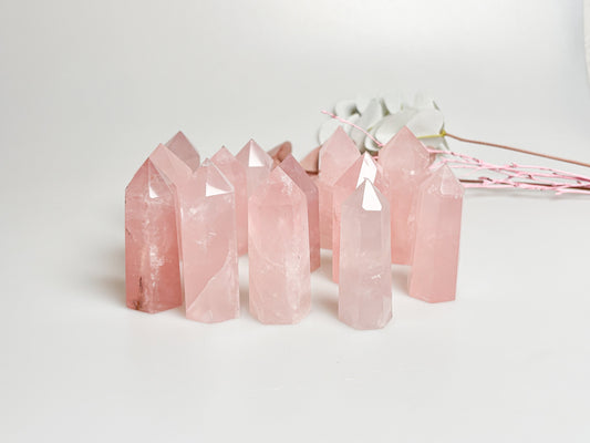 Beautiful rose quartz towers with rainbows - healing crystal for love and harmony, natural stone decoration