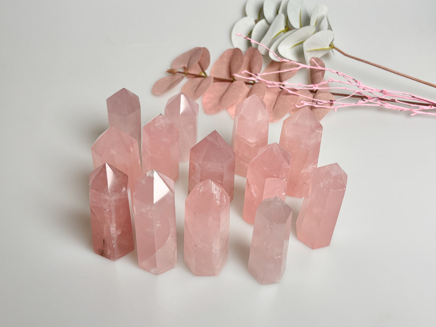 Beautiful rose quartz towers with rainbows - healing crystal for love and harmony, natural stone decoration