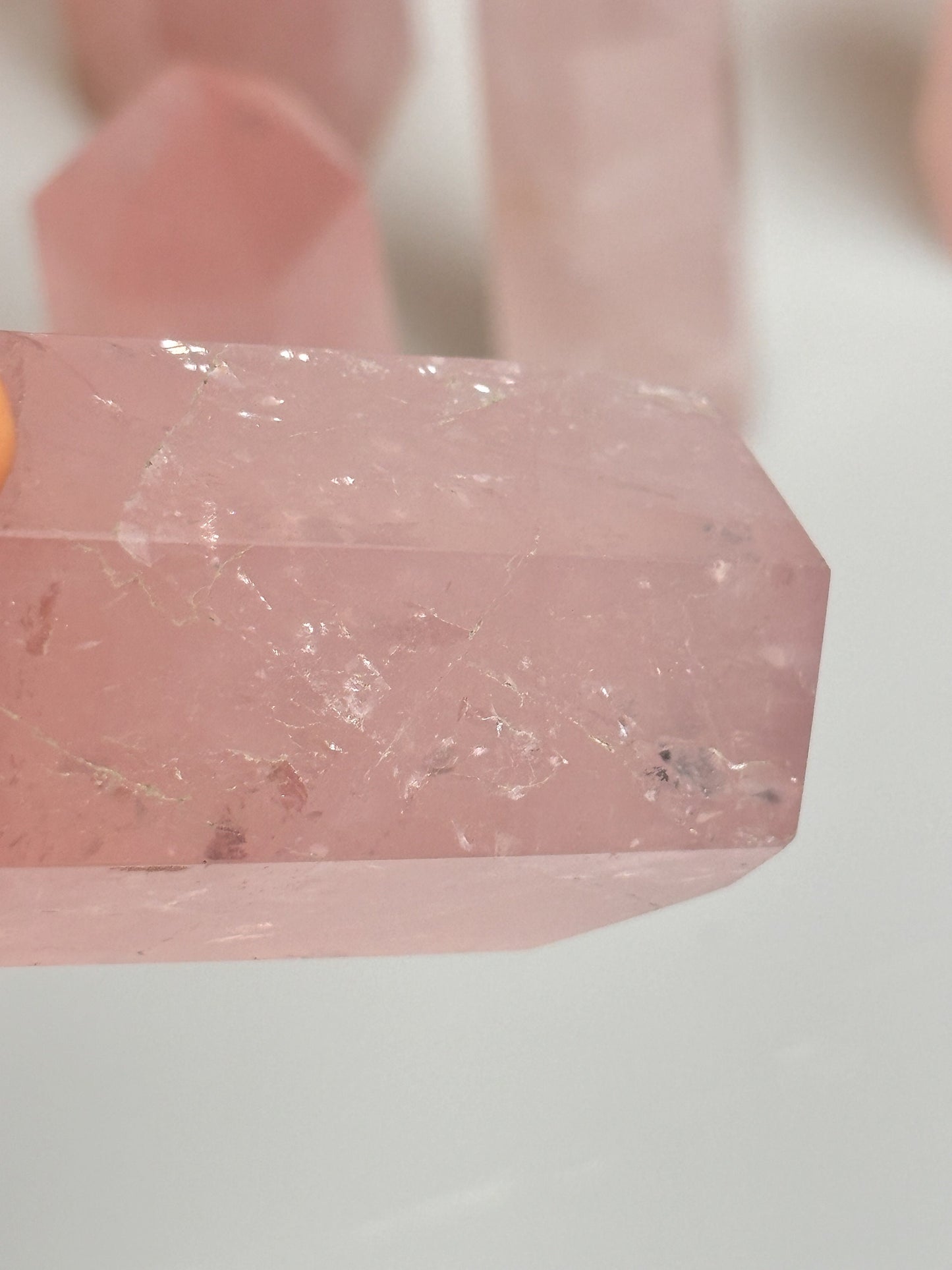 Beautiful rose quartz towers with rainbows - healing crystal for love and harmony, natural stone decoration