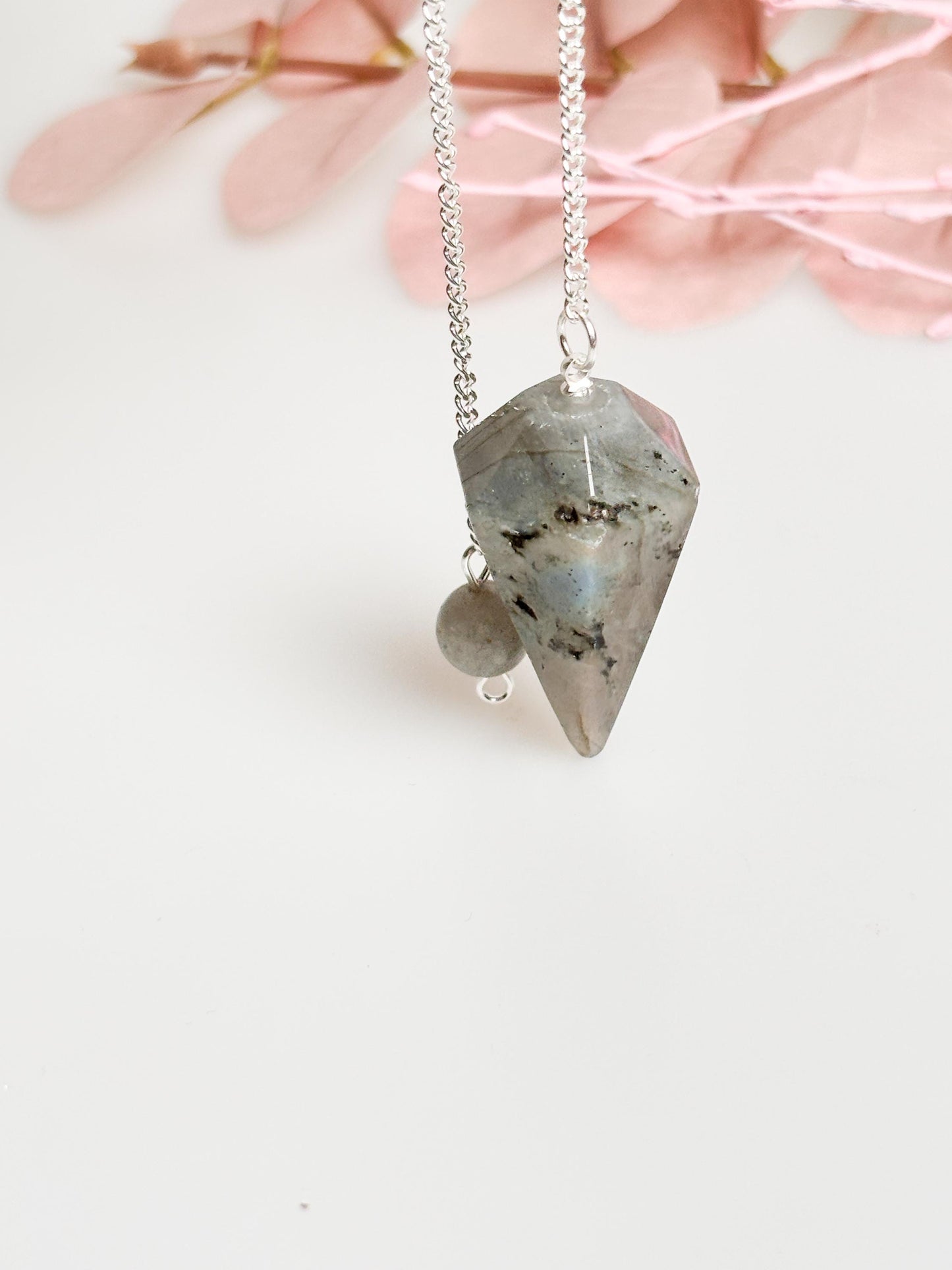 Flashy Labradorite pendulum on chain - beautiful healing stone jewelry for energy work, meditation and esotericism.