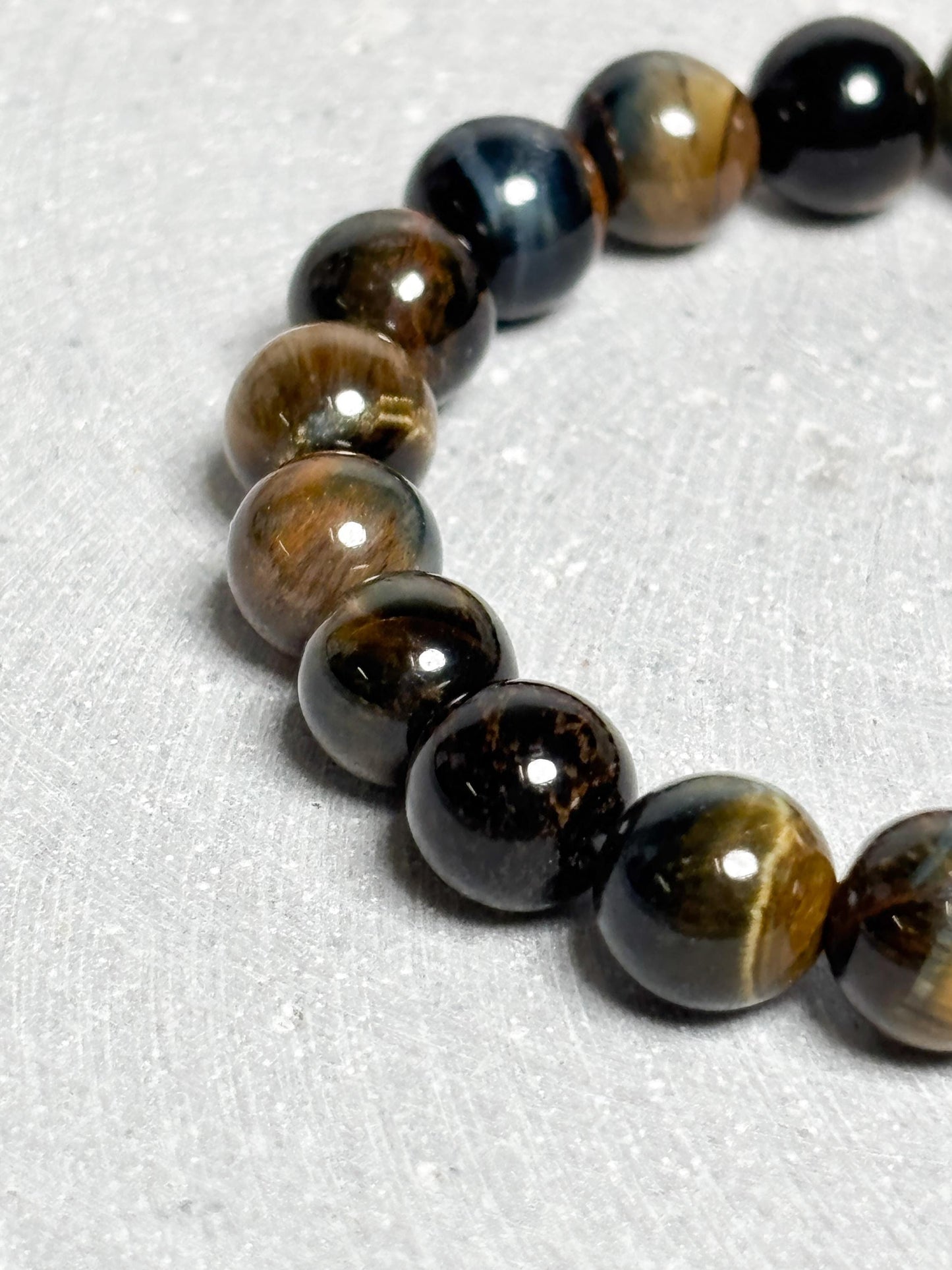 Tigerauge Armband elastisches Perlenarmband ca. 17,5 cm mit 8 mm runden Perlen, Edelstein Schmuck mit schönem Schimmer