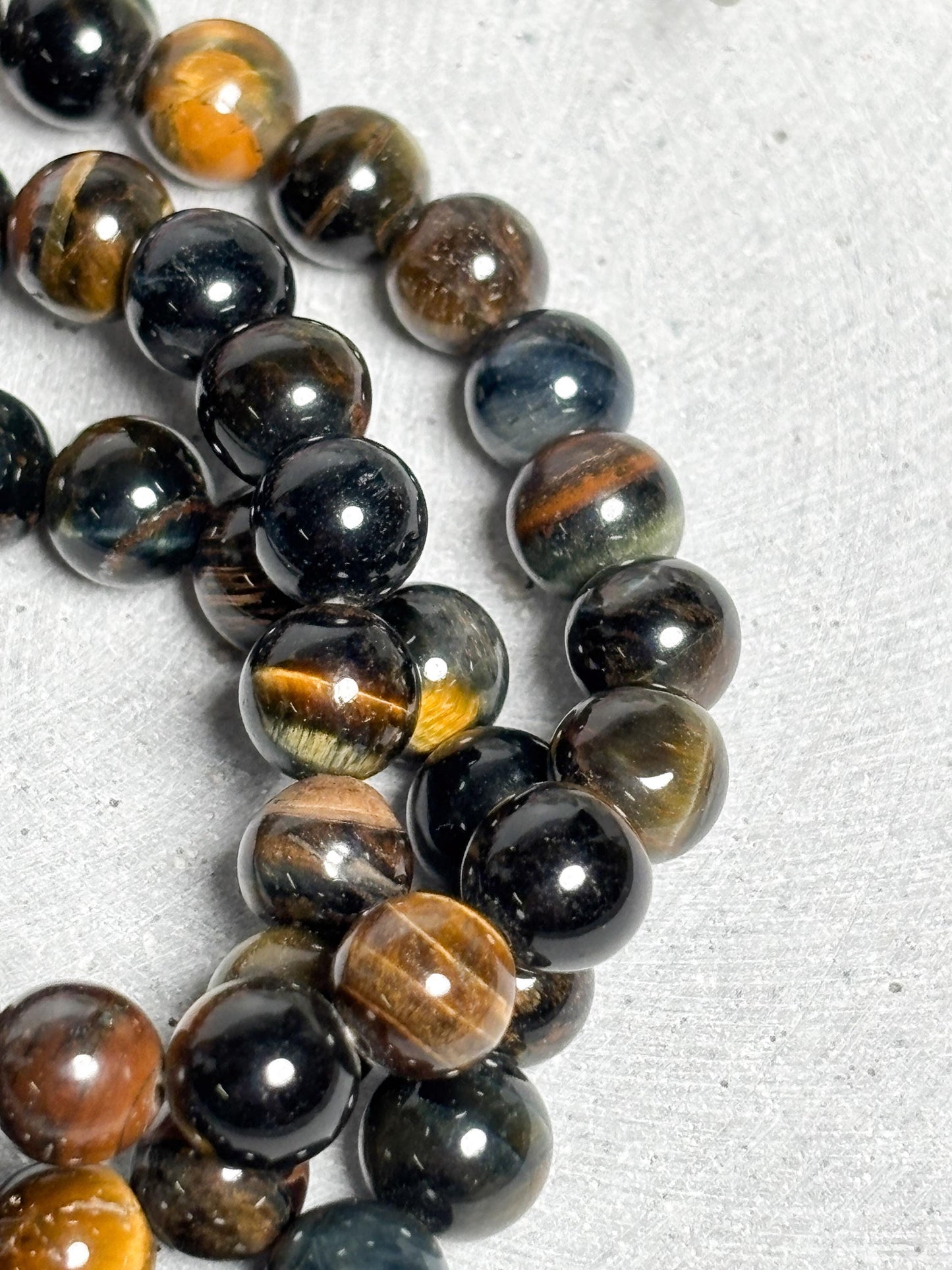 Tigerauge Armband elastisches Perlenarmband ca. 17,5 cm mit 8 mm runden Perlen, Edelstein Schmuck mit schönem Schimmer