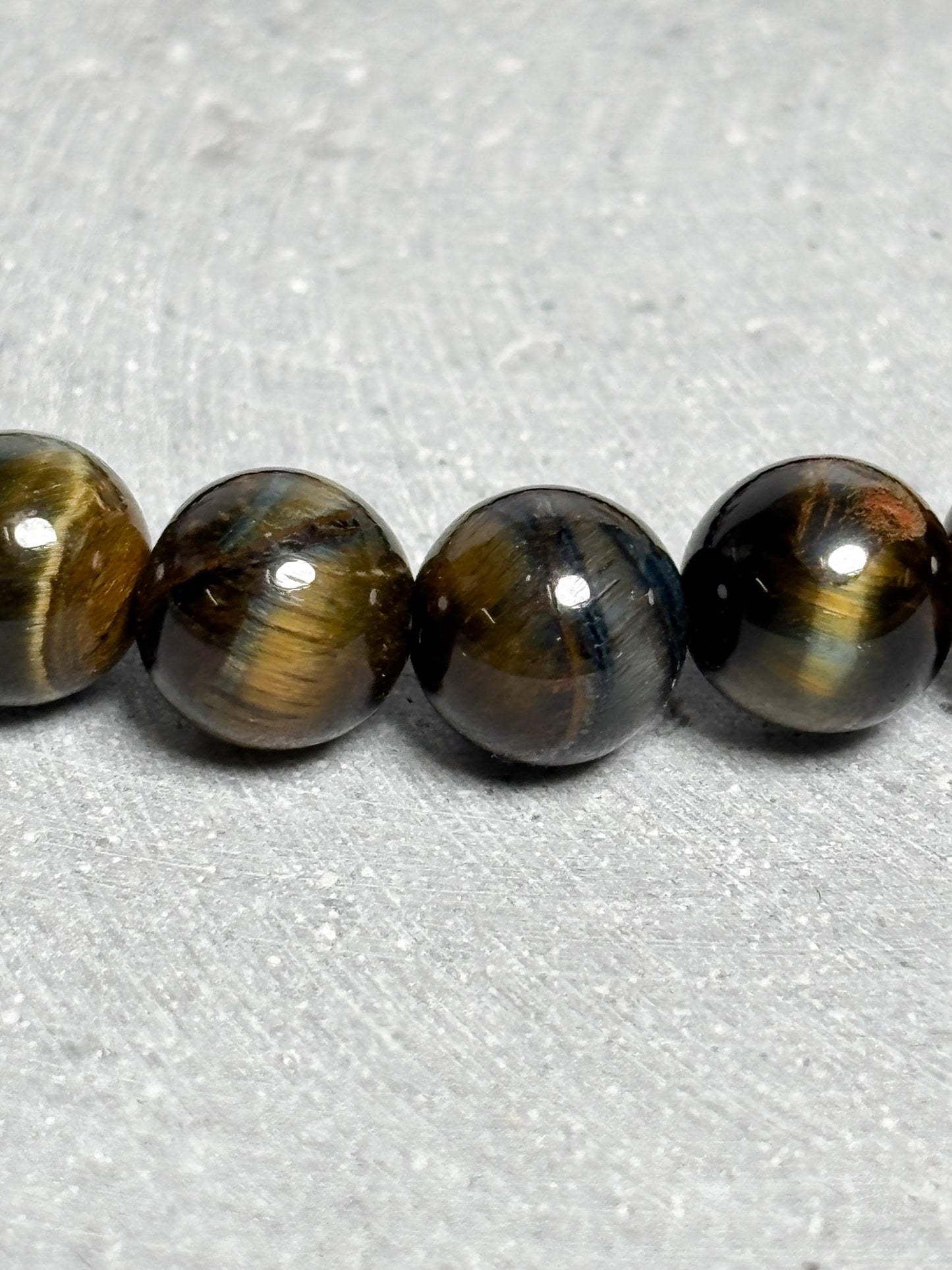 Tigerauge Armband elastisches Perlenarmband ca. 17,5 cm mit 8 mm runden Perlen, Edelstein Schmuck mit schönem Schimmer