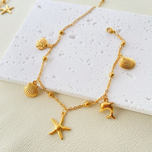 Fußkettchen Gold Edelstahl – maritimes Design mit Seestern & Muschel