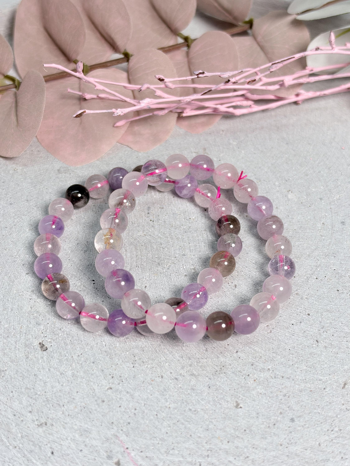 Super Seven Armband 8 mm Perlen elastisch ca. 17,5 cm Edelsteinarmband Super 7 Kristall Schmuck lila rosa